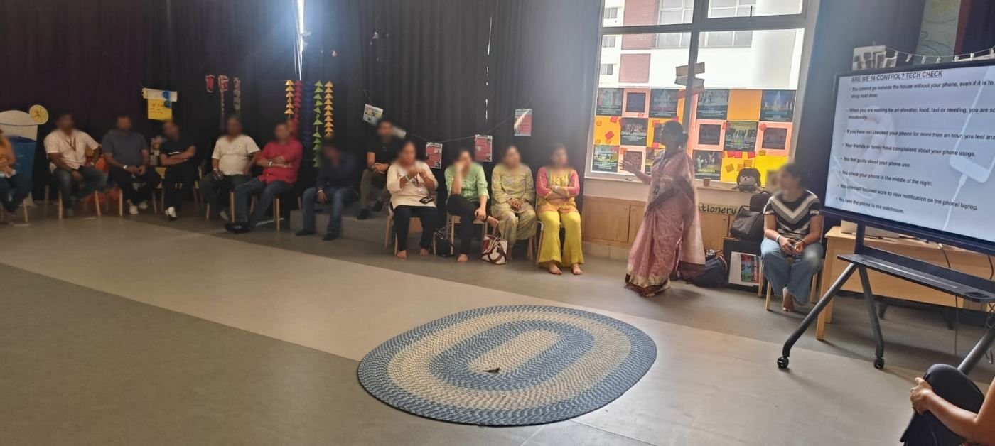 A corporate group seated in a circle during a session